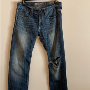 BKE jeans with a ripped knee